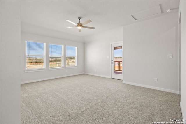 unfurnished room with ceiling fan and carpet flooring