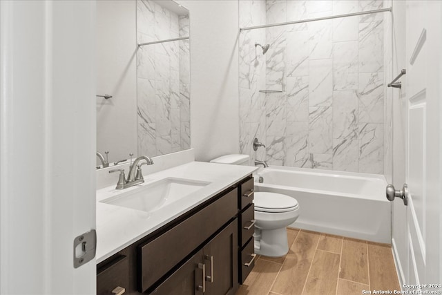 full bathroom featuring vanity, toilet, and tiled shower / bath combo