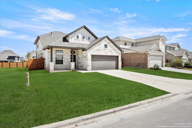 view of front of property with a front lawn and a garage