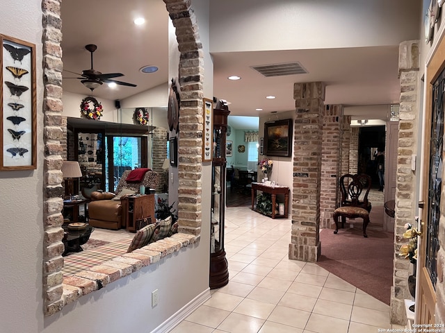 living room with light tile patterned floors and ceiling fan