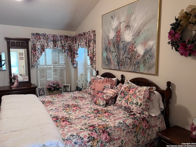 bedroom featuring vaulted ceiling