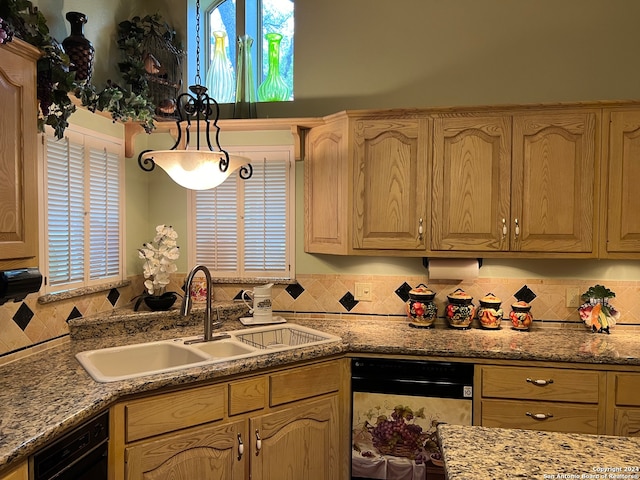 kitchen with sink, tasteful backsplash, dishwasher, and hanging light fixtures