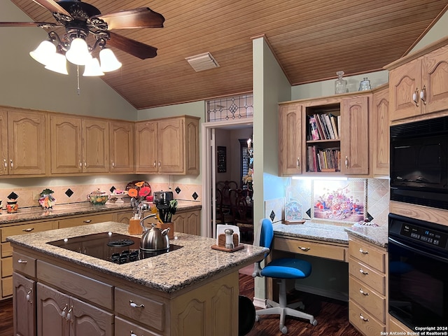 kitchen featuring black appliances, dark hardwood / wood-style flooring, a center island, lofted ceiling, and light stone counters