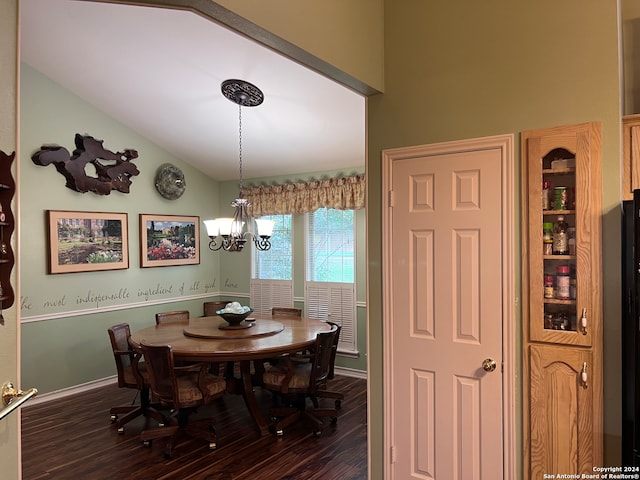 dining space featuring a chandelier and dark hardwood / wood-style floors