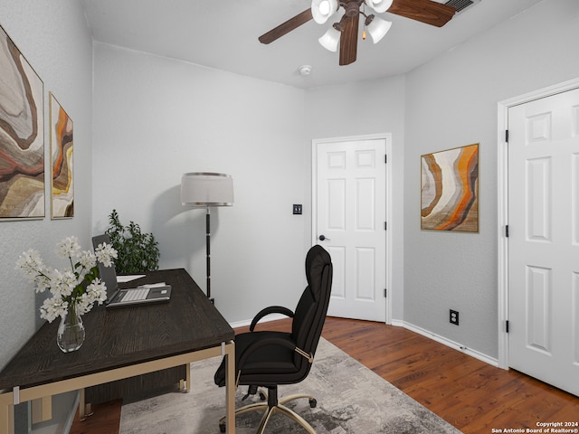 office with hardwood / wood-style flooring and ceiling fan