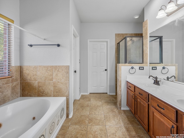 bathroom with vanity, plus walk in shower, and tile patterned floors