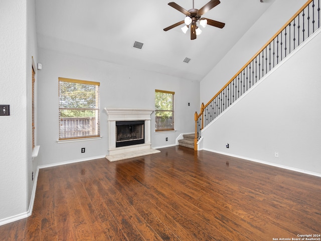 unfurnished living room with ceiling fan, high vaulted ceiling, and dark hardwood / wood-style flooring