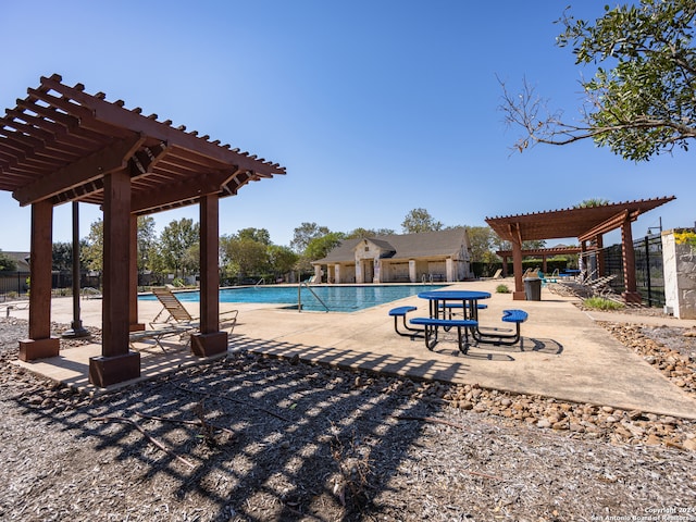 view of swimming pool featuring a patio and a pergola