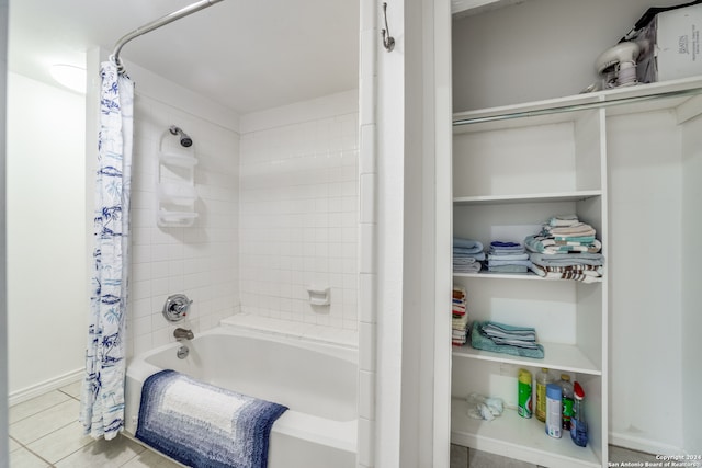 bathroom with shower / tub combo with curtain and tile patterned floors