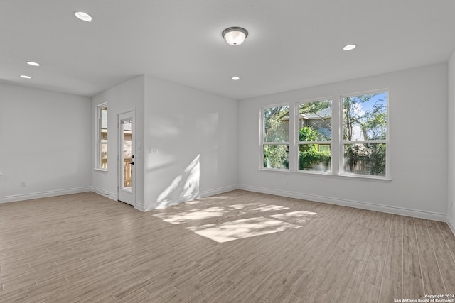 unfurnished room featuring light hardwood / wood-style floors