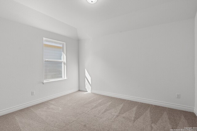 unfurnished room featuring carpet floors