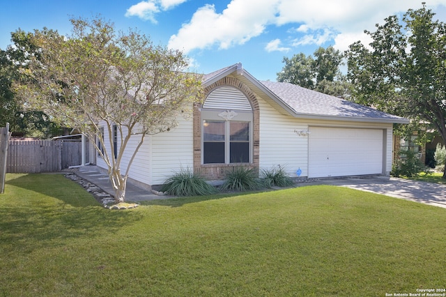 single story home featuring a front yard and a garage