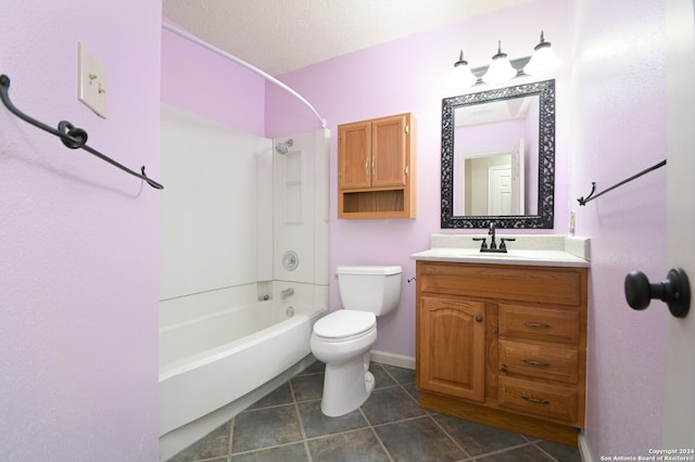 full bathroom with tile patterned floors, toilet, tub / shower combination, vanity, and a textured ceiling