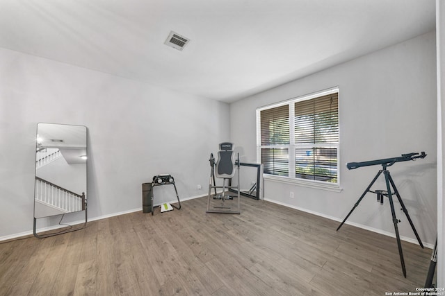 exercise area with hardwood / wood-style flooring