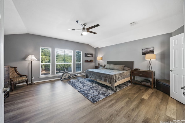 bedroom with vaulted ceiling, dark hardwood / wood-style floors, and ceiling fan