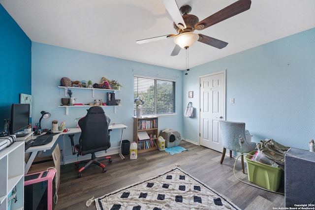 office space with wood-type flooring and ceiling fan