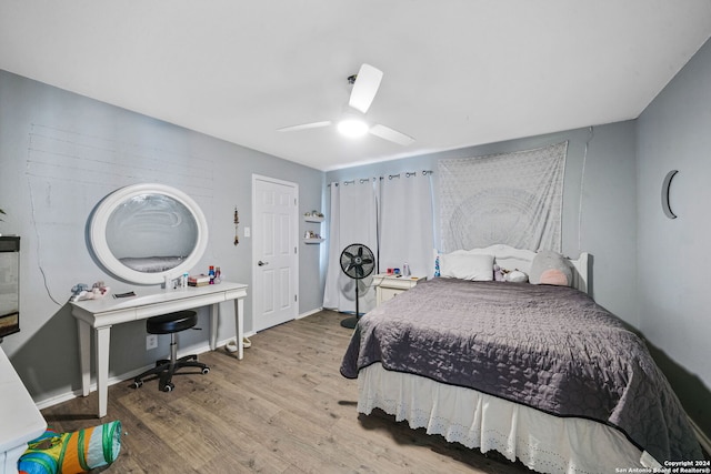 bedroom featuring ceiling fan and light hardwood / wood-style flooring