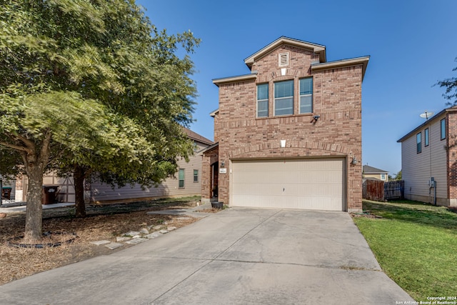 front facade with a front yard and a garage