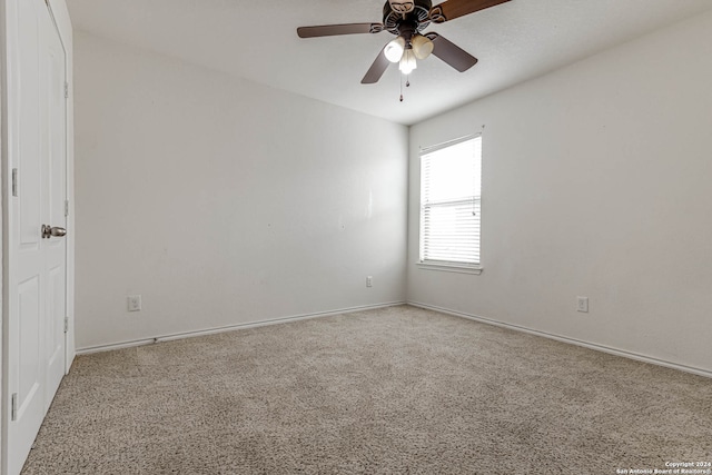 carpeted empty room with ceiling fan