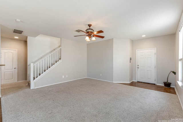 spare room featuring carpet and ceiling fan