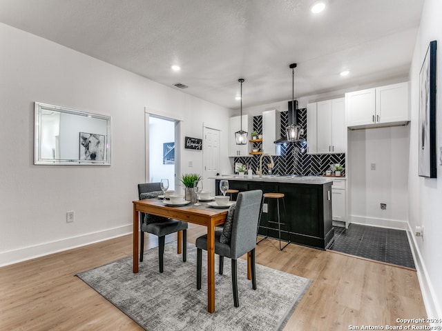 dining room featuring light hardwood / wood-style flooring