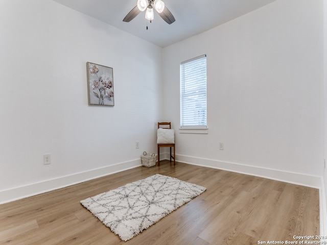 spare room featuring light hardwood / wood-style floors and ceiling fan