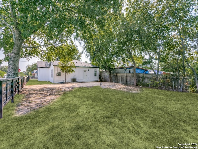 view of yard with central AC