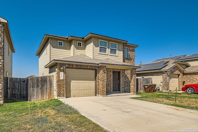 view of front facade with a garage and a front lawn