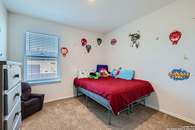 bedroom featuring carpet flooring and baseboards