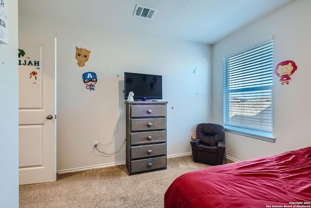 bedroom with visible vents, carpet, and baseboards