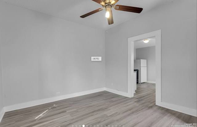 spare room featuring ceiling fan and light wood-type flooring