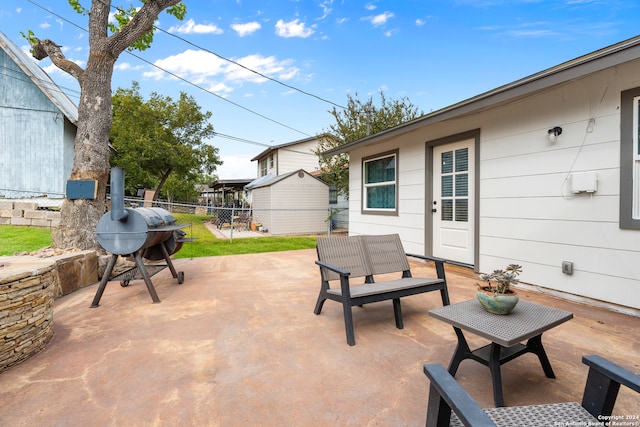 view of patio featuring a storage unit and area for grilling