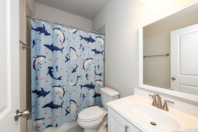 bathroom with vanity, a shower with shower curtain, and toilet