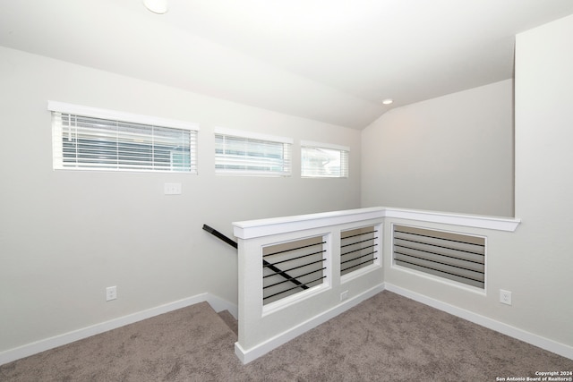 stairs with carpet flooring and vaulted ceiling