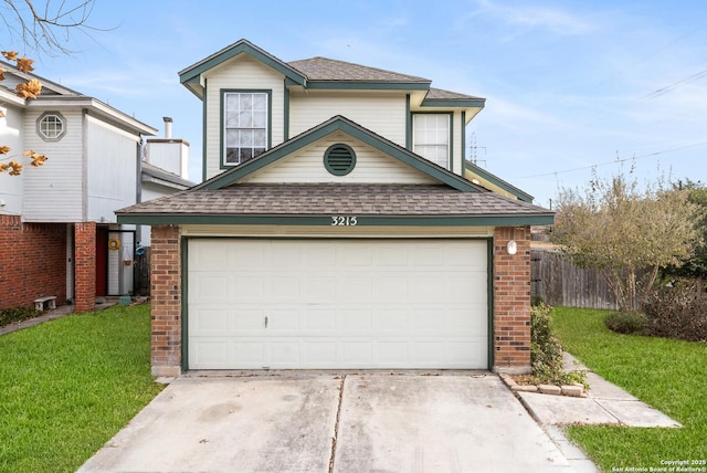 view of front of house featuring a front lawn and a garage