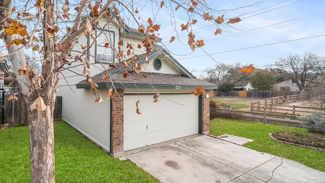 view of side of property with a lawn