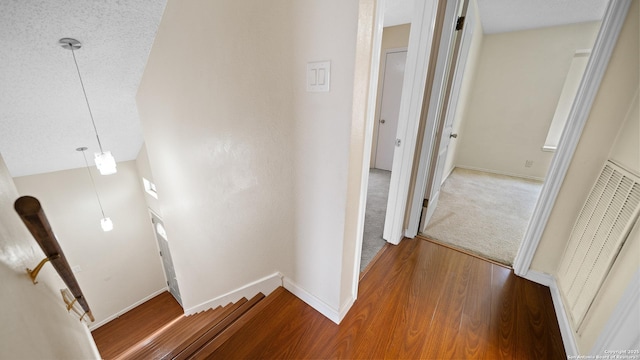 hall with wood-type flooring