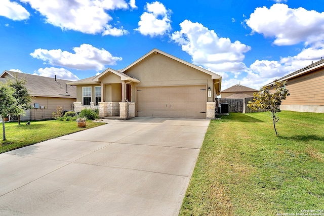 view of front of home with a front yard, a garage, and central AC unit