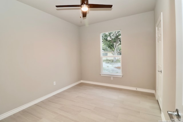 spare room with light hardwood / wood-style flooring and ceiling fan