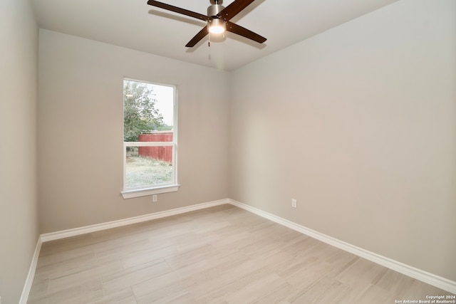 unfurnished room with light hardwood / wood-style flooring and ceiling fan