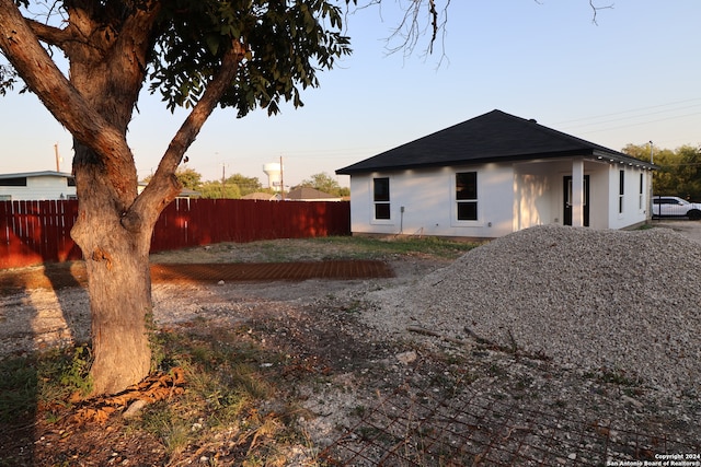 view of property exterior at dusk