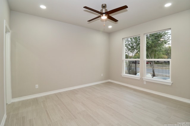 unfurnished room featuring light hardwood / wood-style floors and ceiling fan