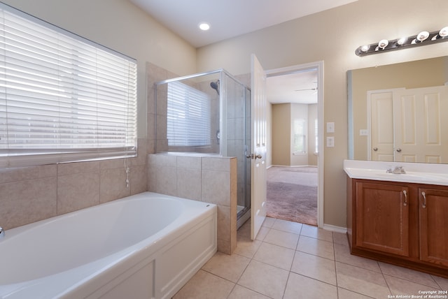 bathroom with vanity, shower with separate bathtub, and tile patterned flooring