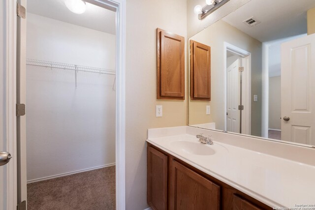 bathroom with visible vents and vanity