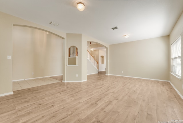 spare room featuring light wood-type flooring