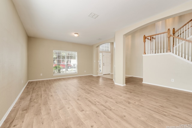 unfurnished room featuring light hardwood / wood-style flooring