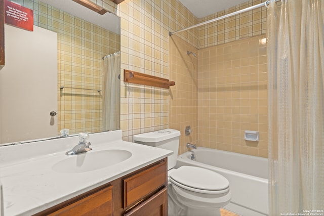 full bathroom with vanity, toilet, and shower / bath combination with curtain