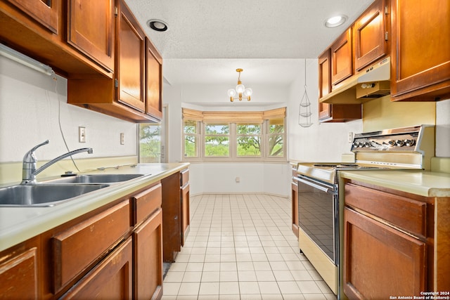 kitchen featuring sink, light tile patterned flooring, stainless steel range oven, hanging light fixtures, and an inviting chandelier