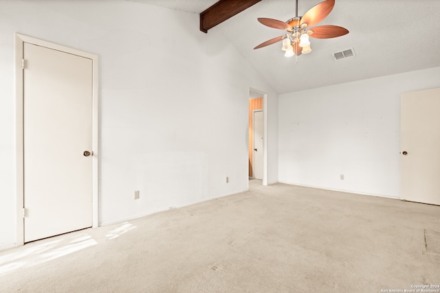 unfurnished room featuring ceiling fan, high vaulted ceiling, beamed ceiling, and light carpet