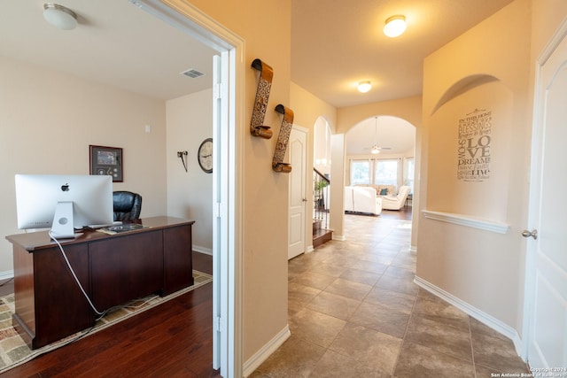 7527 Presidio Hvn, Boerne, TX 78015 - hallway featuring stairway, arched walkways, visible vents, and baseboards